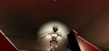 The Locust at the end of a red hallway, lit by a flashlight