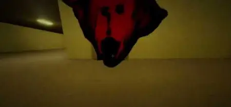 A huge red mask popping up in a yellow hallway